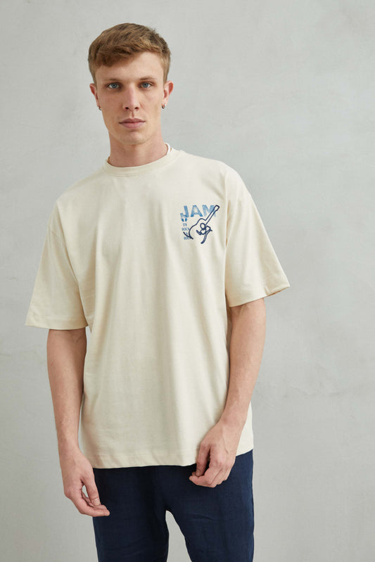 Camiseta beis oversize unisex con estampado de guitarras en algodón 100%