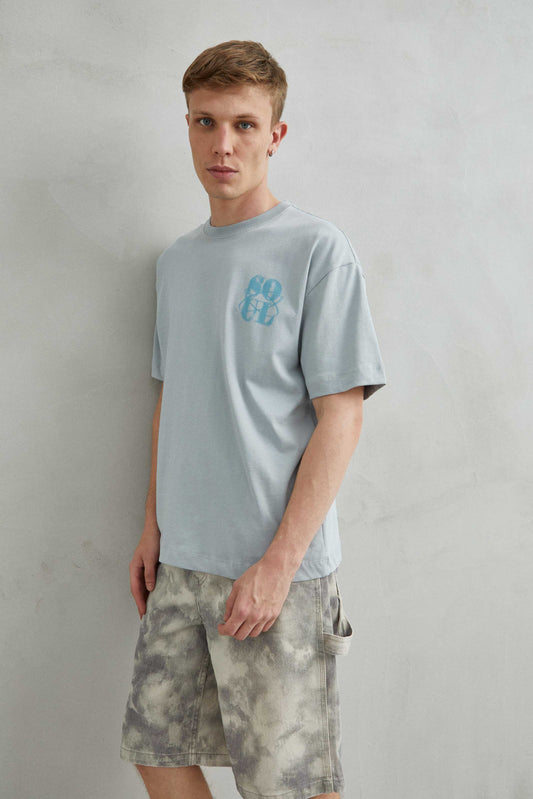Camiseta gris oversize unisex con diseño "SOUL" en efecto de arena en el frente y la espalda