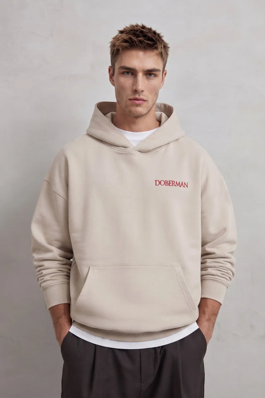 Sudadera beige oversize de hombre con capucha y letras rojas Doberman en el pecho
