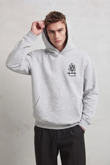 Sudadera gris jaspe oversize de hombre con capucha y pequeño gráfico de flores Les Fleurs, vista frontal