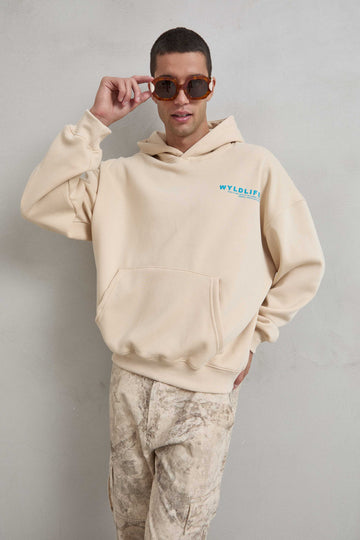 Sudadera beige con estampado WILDLIFE en el frente