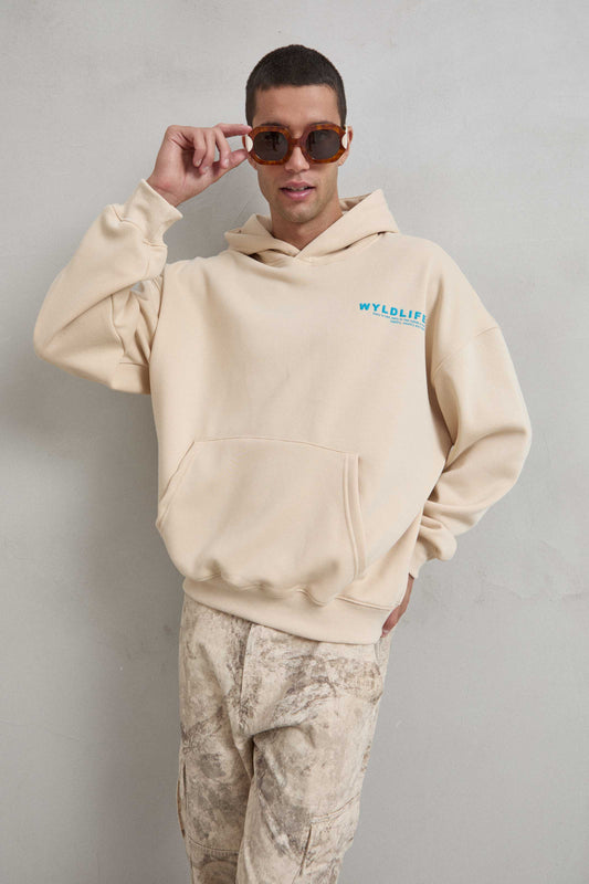 Sudadera beige con estampado WILDLIFE en el frente
